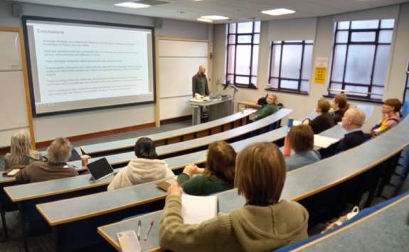 A group of people attending a lecture as part of the programme